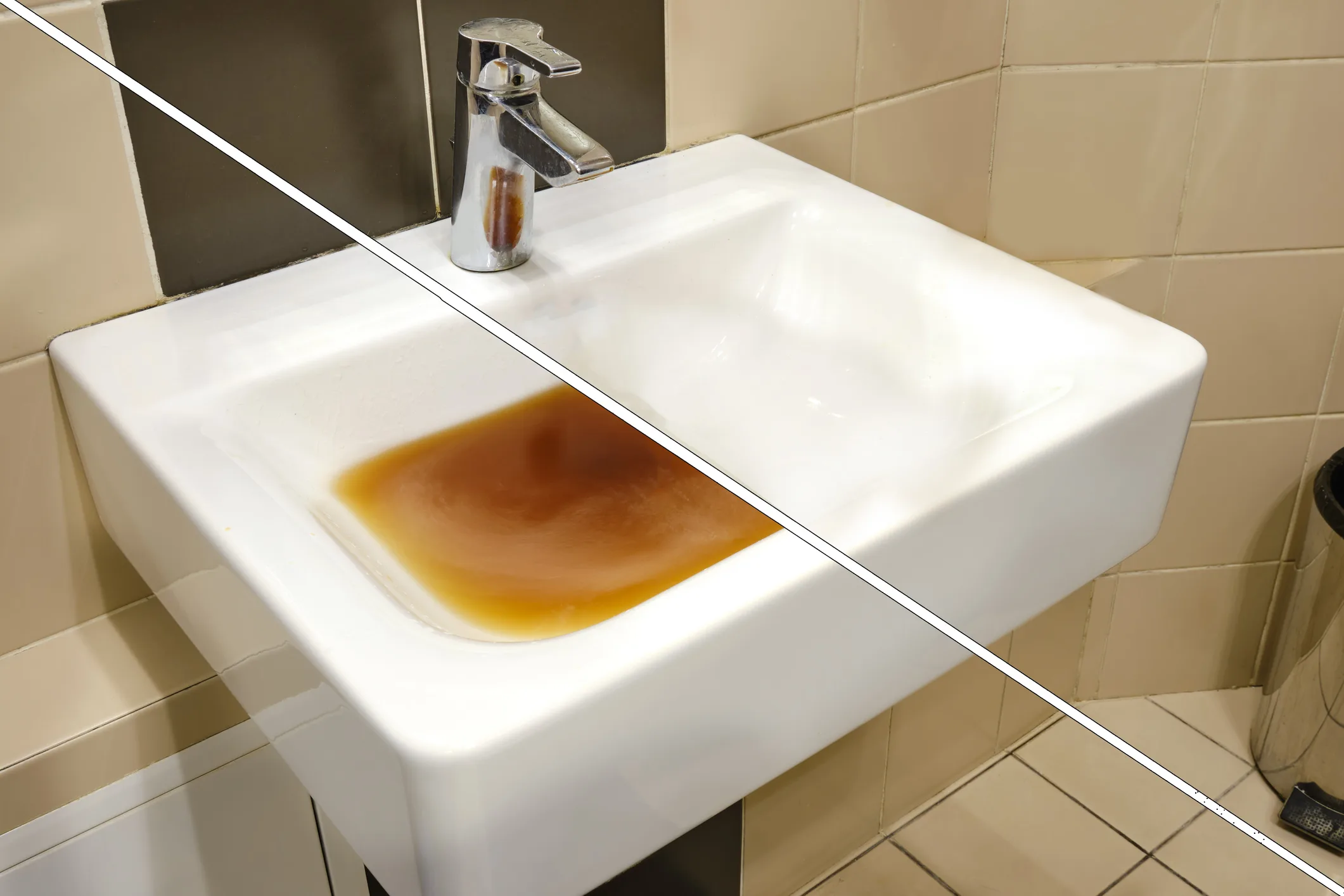 Close-up of a bathroom sink drain running slowly in an East Valley home