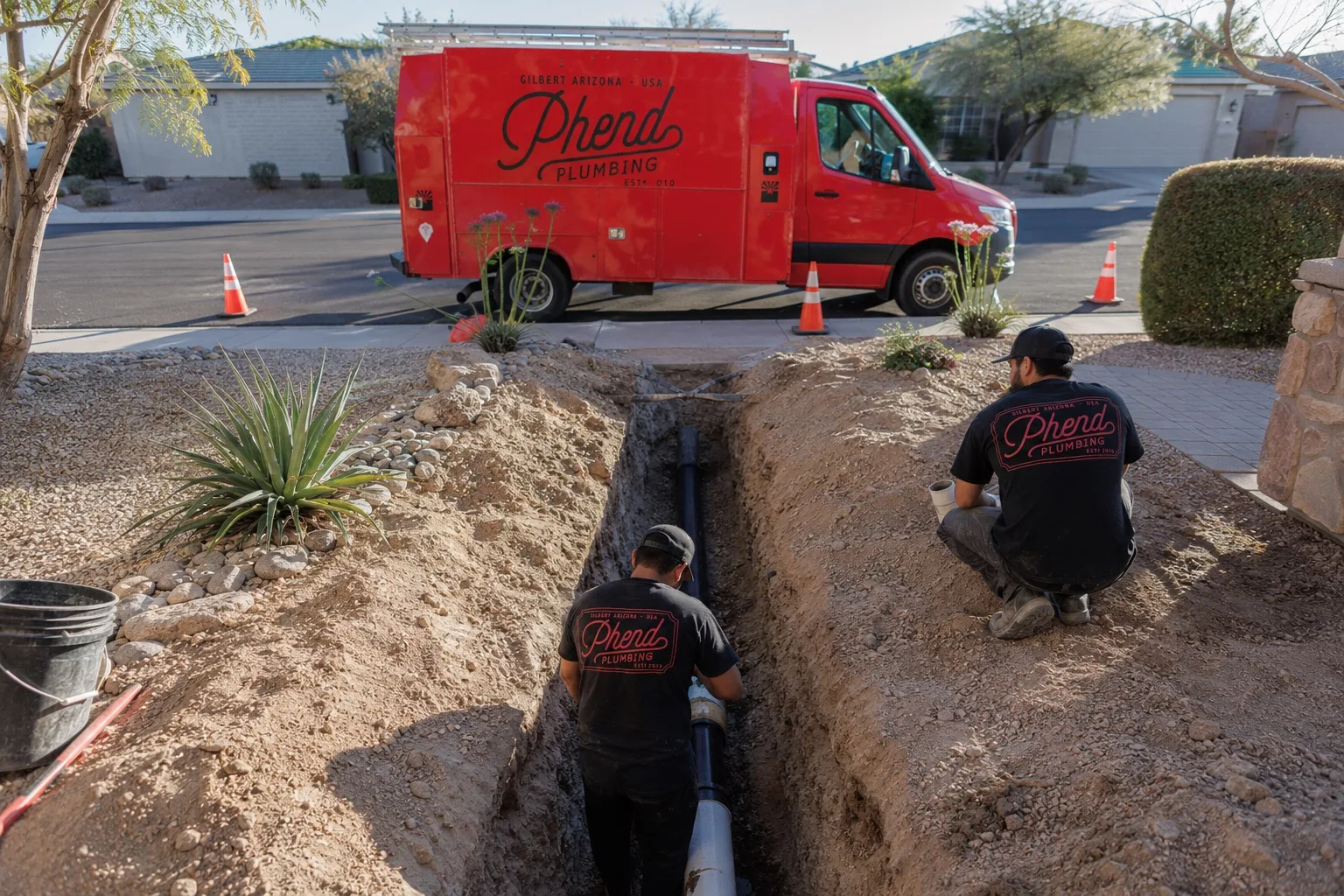 Phend Plumbing crew installing new sewer line in an open trench at an East Valley home